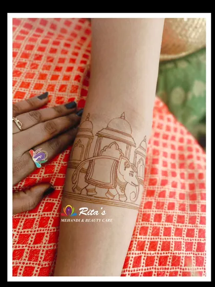 The initial outline of a majestic elephant, the start of a beautiful bridal arm design.