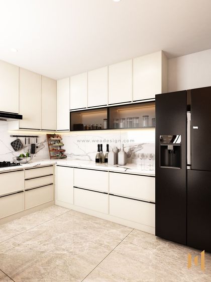 A look at the cooking area, with a sleek black chimney and hob set against the marble-patterned quartz backsplash.