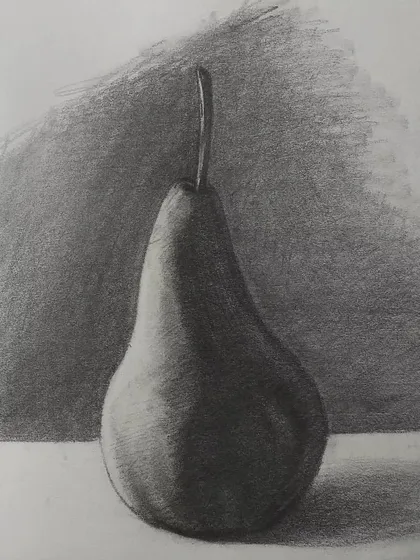 A simple still life drawing of a pear. Practicing with everyday objects is the best way to get good at seeing and drawing light, shadow, and form. It's a fundamental exercise for any artist.
