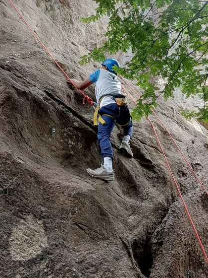 An Air Force team member focuses on his ascent during a specialized training course.