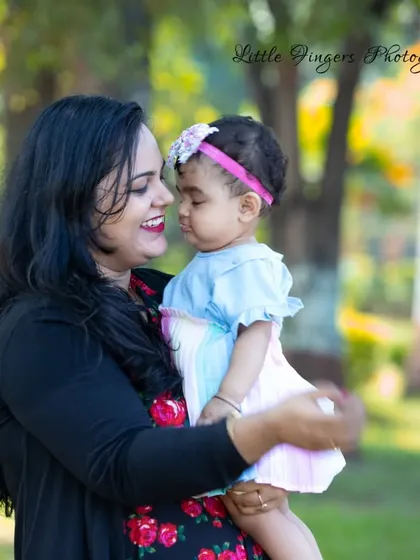 The loving gaze between a mother and her one-year-old daughter.