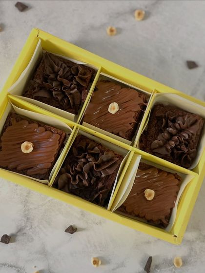 A box of six assorted eggless brownies, showcasing our hazelnut and chocolate fudge varieties. The perfect duo for any chocolate and nut lover.