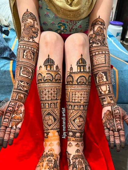 This photo shows the incredible coverage of a full bridal mehndi package. The designs are intricate and extend from hands to elbows and feet to knees.