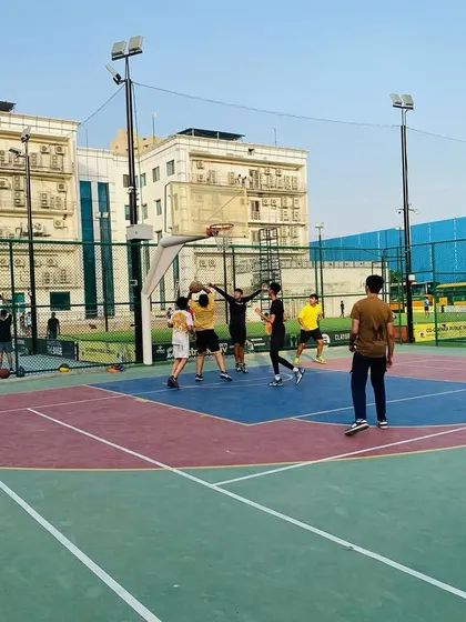 A contested shot in the paint. Our players learn to be aggressive on both offense and defense.