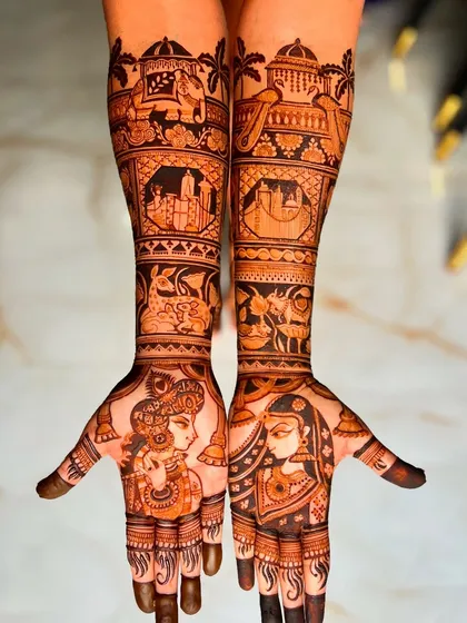 For this bride, we blended traditional motifs with personal memories. Her design includes portraits of Radha and Krishna alongside the skylines of San Francisco and New York City, representing special places in her life.