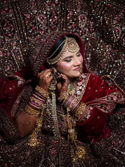 A breathtaking shot of the Muslim bride, with her heavily embroidered dupatta creating a magnificent frame around her.