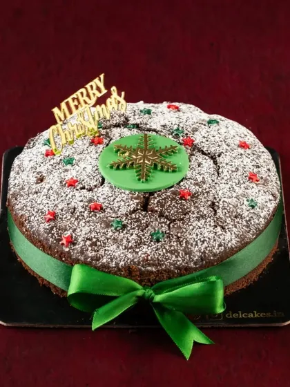 Nothing says Christmas quite like a traditional Plum Cake. Ours is rich, fruity, soaked in rum, and decorated with a festive green ribbon for that extra special touch.