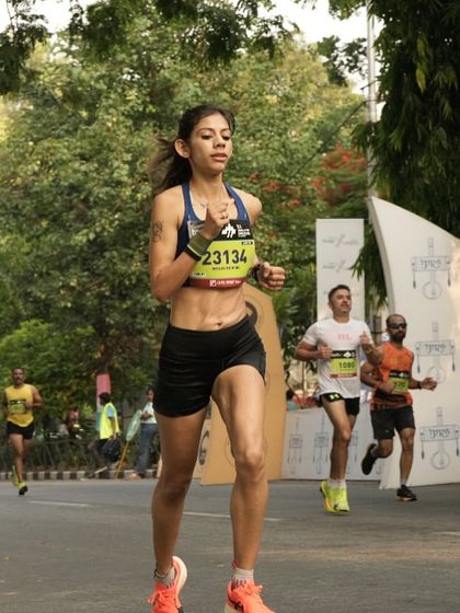 Focused and in the zone during the TCS World 10K in Bengaluru. My coaching emphasizes maintaining form and mental clarity, especially when surrounded by the energy and pressure of a big race.