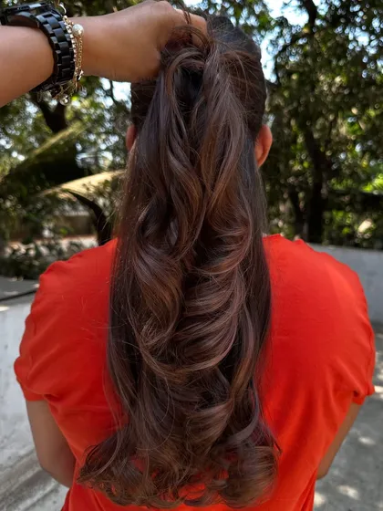A simple highlight refresh can make a world of difference. I brightened up her existing color and gave her a fresh style, making her hair look vibrant and healthy again.