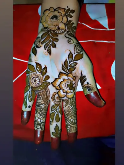 I love how this bold floral design turned out after the henna paste was removed. The rich, reddish-brown stain really makes the shaded flowers and leaves pop.