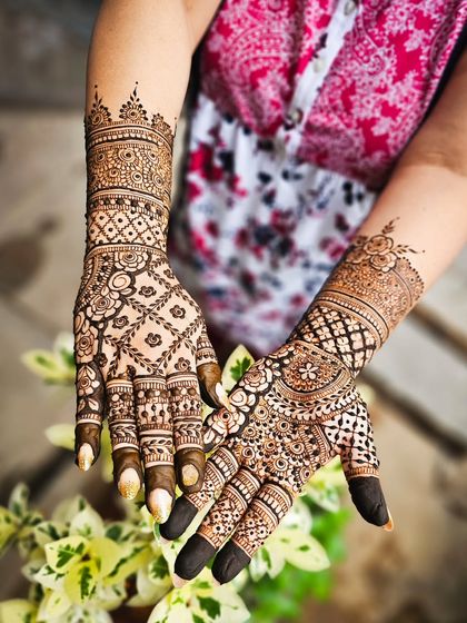 A lovely bridal design with a mix of florals and geometric patterns, perfect for any celebration.