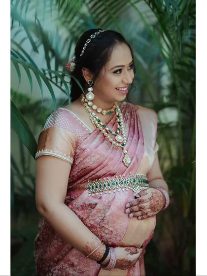 Celebrating the strength and beauty of motherhood. This portrait was taken during a garden maternity session, capturing the mother-to-be's serene glow. Dressed in a stunning pink silk saree and traditional jewelry, she embodies grace and anticipation.