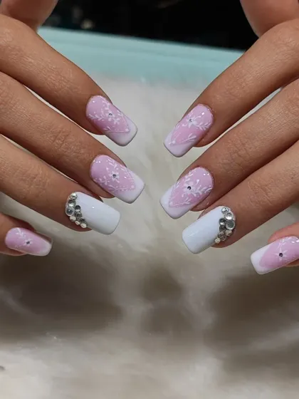 A full view of the floral French manicure, showing the beautiful combination of white tips, pink ombre, and rhinestone clusters.