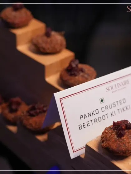 Panko Crusted Beetroot ki Tikki, elegantly presented on a wooden block. This dish is a testament to our innovative approach to vegetarian appetizers.