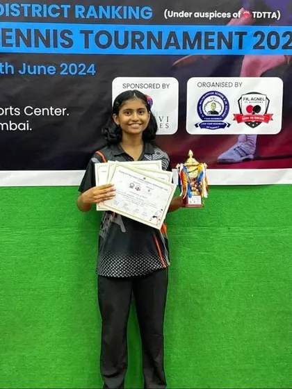 Swara Jangade displays her certificates after clinching runner-up spots in the U-15 and U-19 categories and a third spot in the U-17 category at the District Ranking Tournament.
