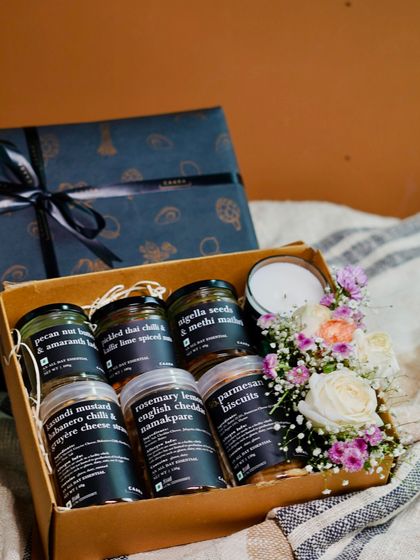 The Wexcombe box is designed for the perfect cocktail evening. It contains a curated selection of our finest savoury jars, like pickled Thai chilli nuts and kasundi mustard cheese straws, beautifully packaged with fresh flowers.