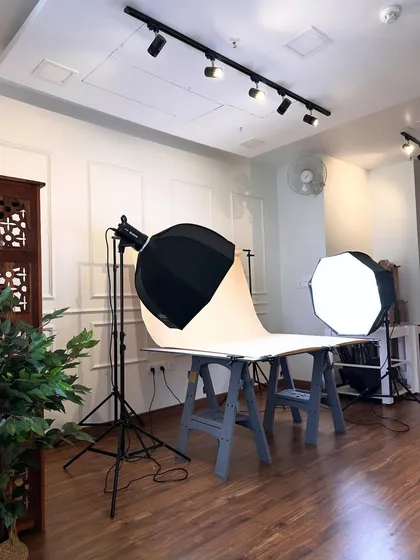 My product photography setup, complete with professional lighting and a clean white backdrop. This is where I create those crisp, eye-catching e-commerce shots.