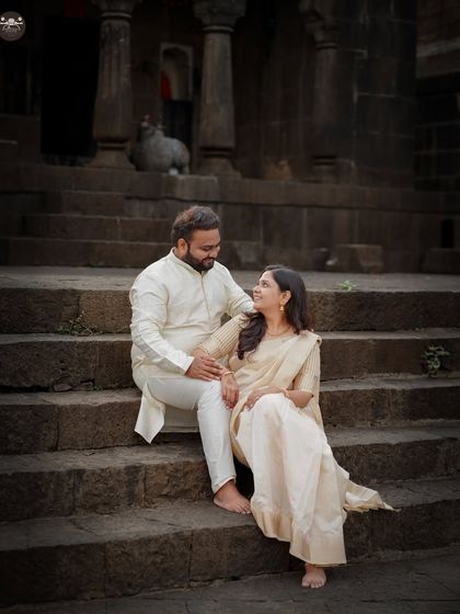 A romantic portrait of the couple seated on the steps of an ancient temple. I guide couples into comfortable poses that feel authentic and connected.