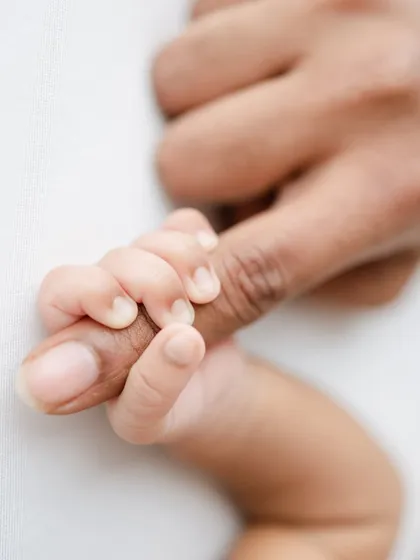 It's all about the tiny details. A baby's grip is one of those fleeting reflexes that we love to capture, a beautiful symbol of the instant bond between a parent and their child.