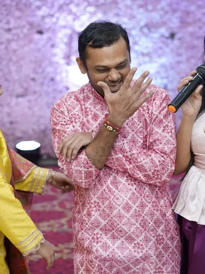 A candid shot of pure laughter during a baby shower game. These are the moments that families will look back on and cherish for years to come.