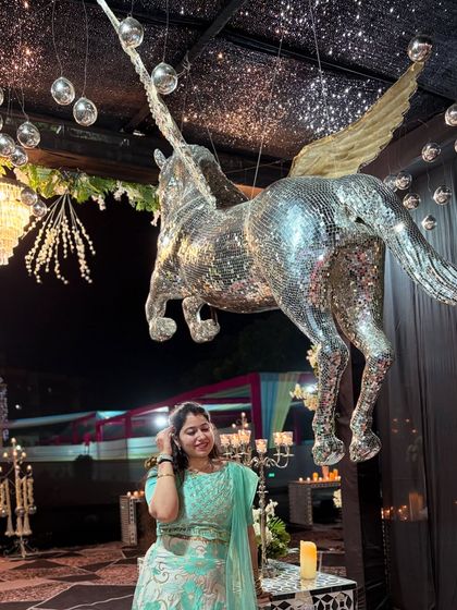 A whimsical moment next to a disco-ball unicorn at a sangeet. I love working with unique wedding themes to create choreography that is just as magical and memorable.