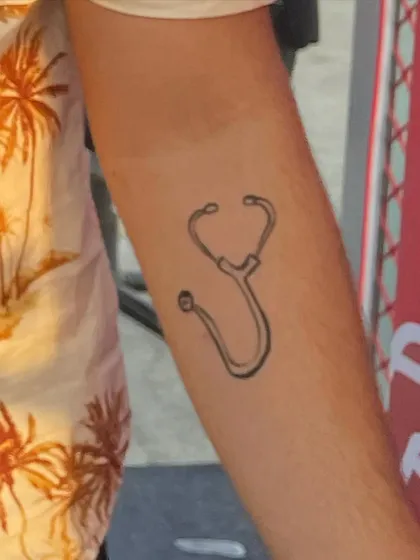 A custom stethoscope design painted on the arm for a medical student at a festival. I love creating personalized art that means something to you.