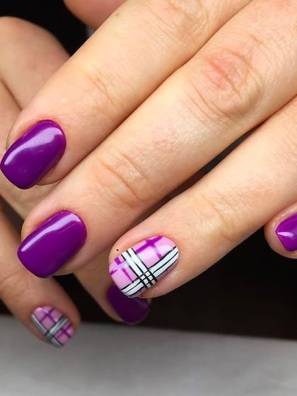A chic and preppy design. This set features bold purple nails paired with accent nails showcasing a pink and purple plaid pattern.