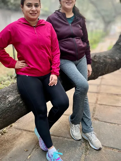 Two of our members taking a break on a tree branch during a park run. We always find time for some fun and photos.