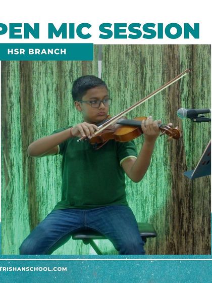 A photo of a young student playing the violin at our HSR branch open mic.