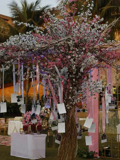 A 'memory tree' adorned with photos of the couple and ribbons, allowing guests to take a walk down the couple's memory lane.