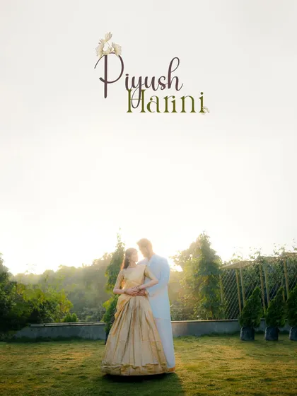 A wide shot of the couple embracing in a field, with the bright sun creating a beautiful haze. This image has a dreamy, ethereal quality perfect for a love story.