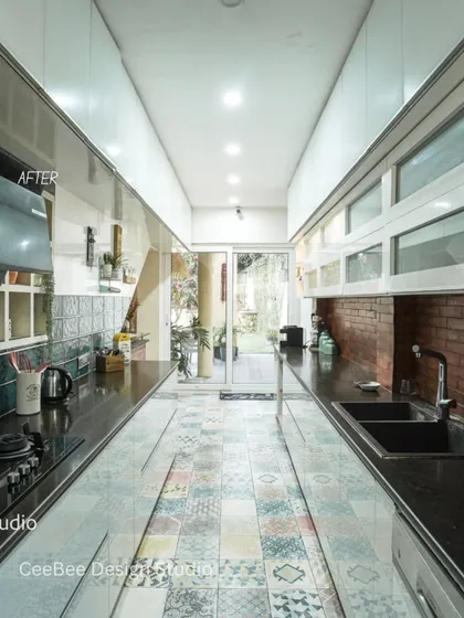 The "after" shot of the galley kitchen, showing the complete transformation from a garden.