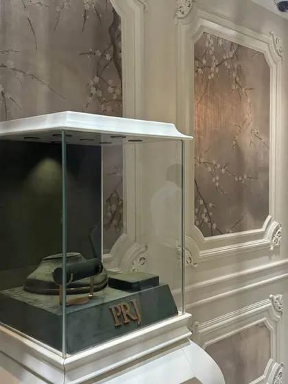 Our in-house masterpieces on display. This jewelry store installation shows how our custom wallcoverings, framed by ornate molding, can create an atmosphere of pure luxury and refinement.