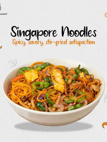 Our Singapore Noodles are a stir-fried delight, featuring thin rice noodles tossed with paneer, capsicum, and onions in a spicy, savory sauce.