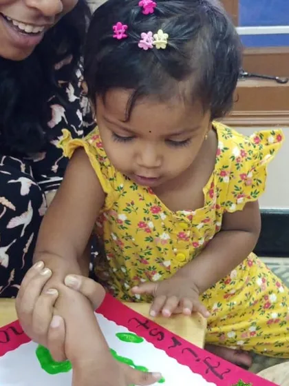 A mother and her young child work together on a craft during our Parent Orientation Day. These moments are precious for building a bridge between home and school.