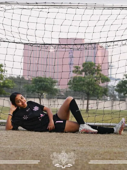 Relaxed but ready. Coach Shreya takes a moment in the goal, embodying the balance of passion and professionalism we value.