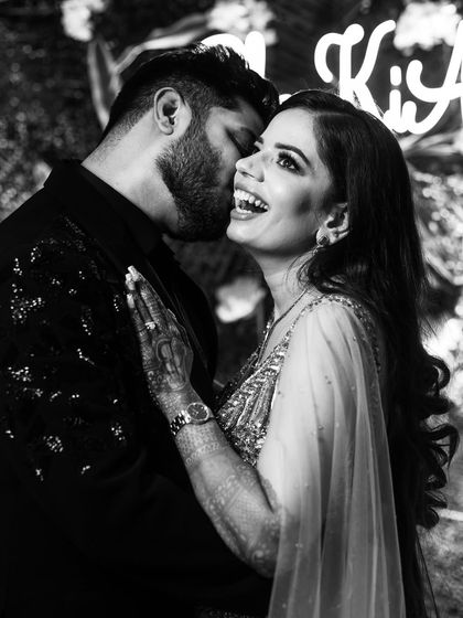 A candid black and white photo full of laughter and joy. These are the moments that truly matter.