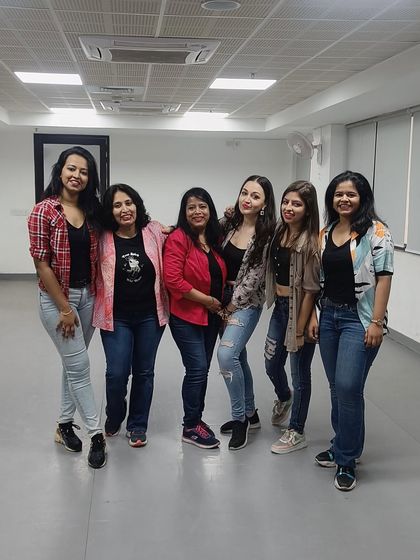 The ladies from the "I Wanna See You Dance" routine posing together. Their fun and sassy energy shines through even in a photo.