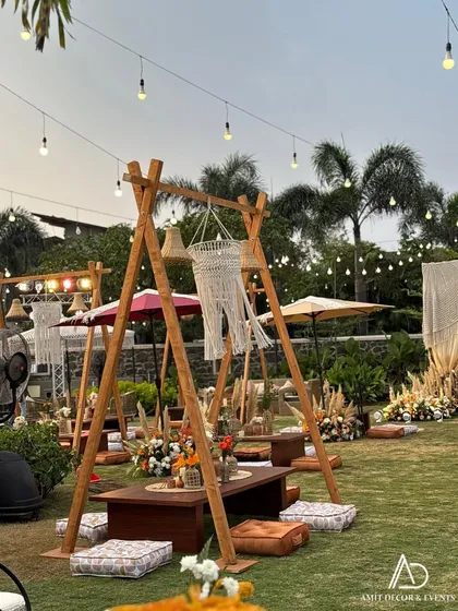 A key feature of this boho setup was the A-frame swing structures with low tables and floor cushions, creating fun and interactive seating areas for guests.