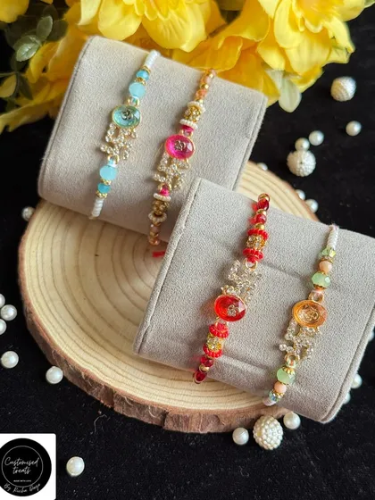 Personalized initial rakhis for that extra special touch. These beautiful rakhis feature a custom initial charm, making it a truly one-of-a-kind gift for your brother.