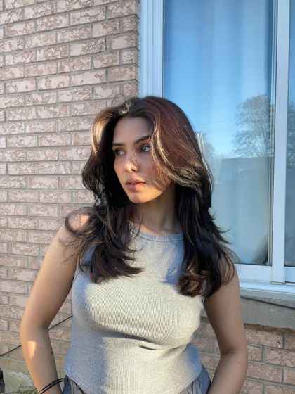 A sunkissed selfie showing my hair in bright, natural light. This is perfect for hair care or color brands, as it showcases the hair's health and dimension.