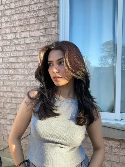 A sunkissed selfie showing my hair in bright, natural light. This is perfect for hair care or color brands, as it showcases the hair's health and dimension.