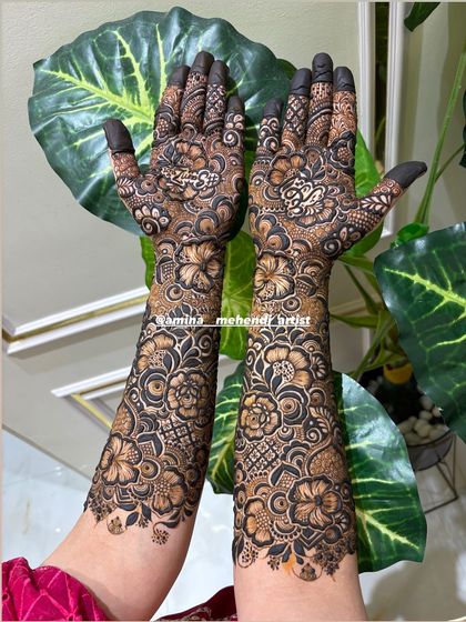 A stunning design captured against a leafy background, emphasizing the organic and floral nature of the art.