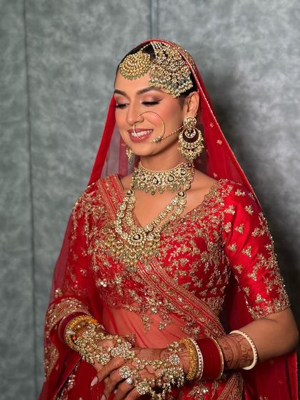 A joyful moment captured, showing the bride's radiant smile. The makeup is designed to last through all the emotions of the big day, keeping her looking flawless.