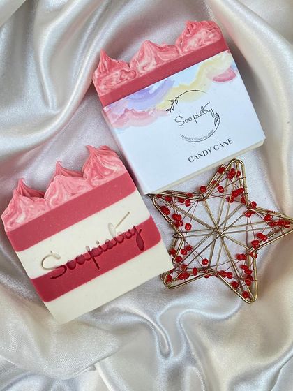 Another view of the Candy Cane soap, complete with its signature red and white stripes and piped top.