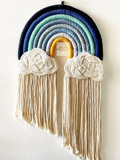 This rainbow in shades of blue and green with a pop of yellow feels like a cool, calming ocean wave. It's a more modern take on the classic rainbow design.