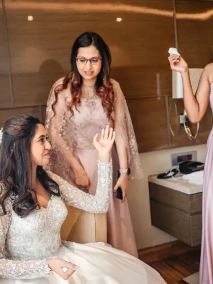 A bridesmaid sheds a tear of joy for her friend, the bride. The emotions of the bridal party are an important part of the wedding story.