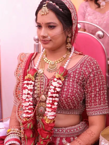 A serene moment during the wedding ceremony. The makeup is kept minimal and traditional, with a focus on clean skin and subtle definition to honor the sanctity of the occasion.