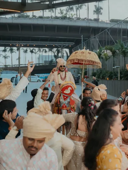 The groom's grand arrival, or baraat, is an event in itself. We coordinate every detail, from the decorated horse to the jubilant procession, making it a high-energy start to the wedding festivities.