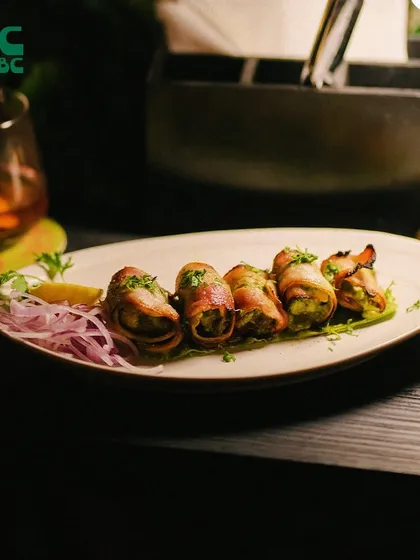 These bacon-wrapped appetizers are the perfect savory bite to start your meal. They are juicy, flavorful, and pair wonderfully with one of our craft beers.